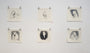 Six pencil sketches by Karla Ortiz are displayed on a white wall in two rows, featuring stylized animals and human figures with a mix of realism and imagination. Each piece uses ink and graphite for depth, held up by two metal clips.