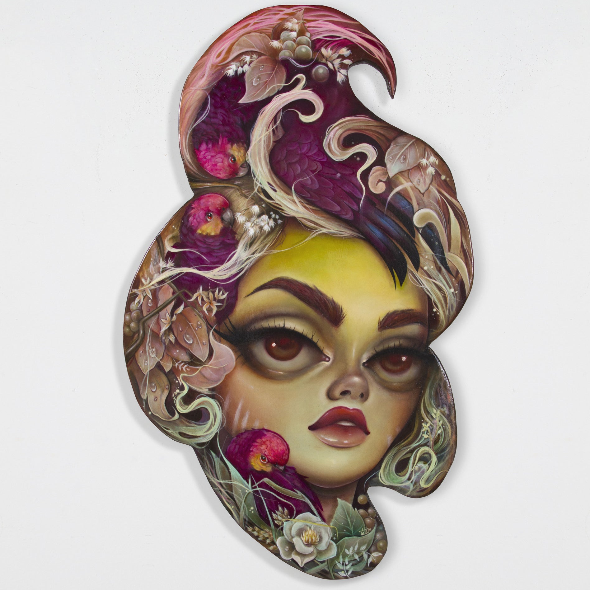 A surreal artwork by Tatiana Suarez features a womans face with large eyes and stylized lips. Her hair intricately blends colorful flowers, birds, leaves, and abstract patterns into a whimsical composition on oil on wood.