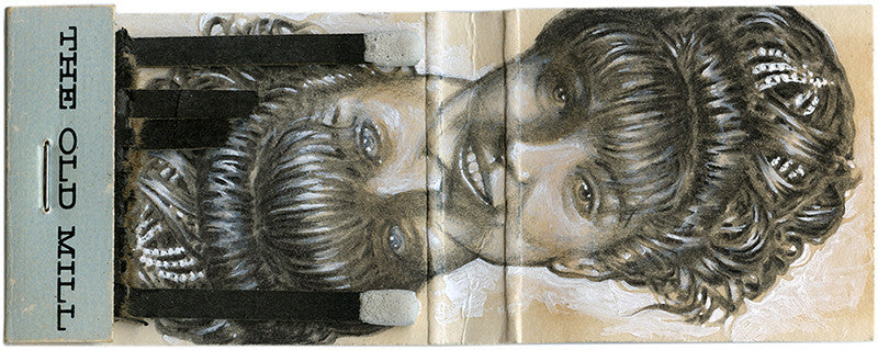 Jason DAquinos graphite artwork on a found matchbook features a womans detailed hairstyle on the cover, labeled The Packard Saw Mill. The design uniquely mirrors her face both right-side-up and upside-down.