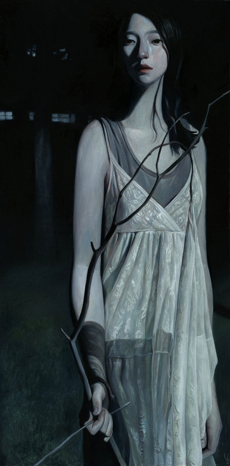 In a dim, moody scene reminiscent of oil on wood, a figure with long dark hair stands in a white layered dress, clutching a twisted branch in shadows. The atmosphere evokes the haunting beauty of Joanne Nams art.