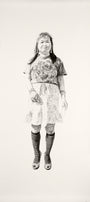 Charcoal and graphite sketch by Joel Phillips features a person with shoulder-length hair in a T-shirt, knee-length skirt, striped knee-high socks, and open-toed shoes. Inspired by the vibrant San Francisco art fairs, the figure stands against a plain background.