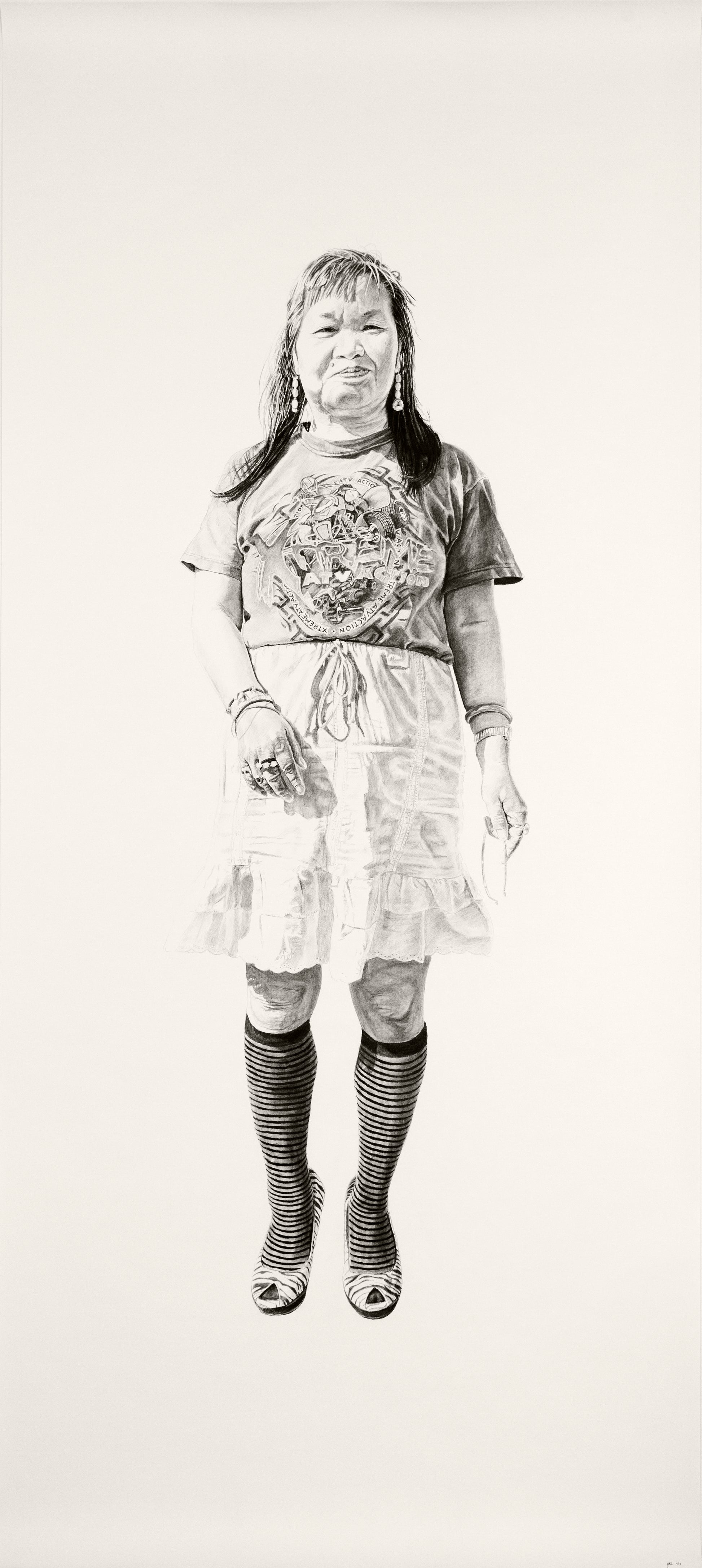 Charcoal and graphite sketch by Joel Phillips features a person with shoulder-length hair in a T-shirt, knee-length skirt, striped knee-high socks, and open-toed shoes. Inspired by the vibrant San Francisco art fairs, the figure stands against a plain background.