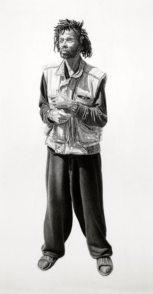 A Joel Phillips charcoal and graphite artwork depicts a bearded man with textured hair, wearing a denim vest over a long-sleeve shirt, loose pants, and sandals. He stands in a relaxed posture, one hand in his vest.