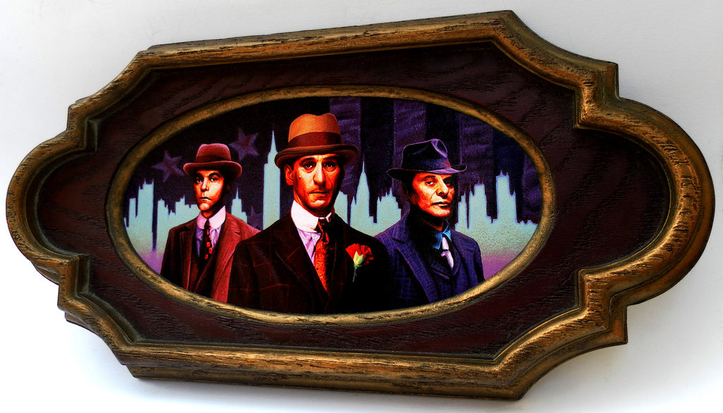 An oval JoKa painting of three men in early 20th-century suits and hats, set against a cityscape evoking Martin Scorseses Gangster Empire, features an ornate dark wood frame, echoing classic elegance.
