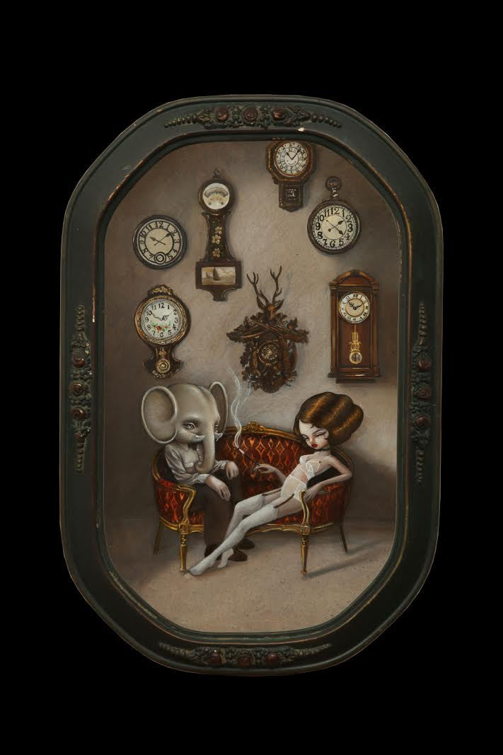 A surreal Kukula art piece depicts a woman with an intricate hairdo alongside a person with an elephant head on a red couch, set within an antique convex frame, surrounded by ornate wall clocks.
