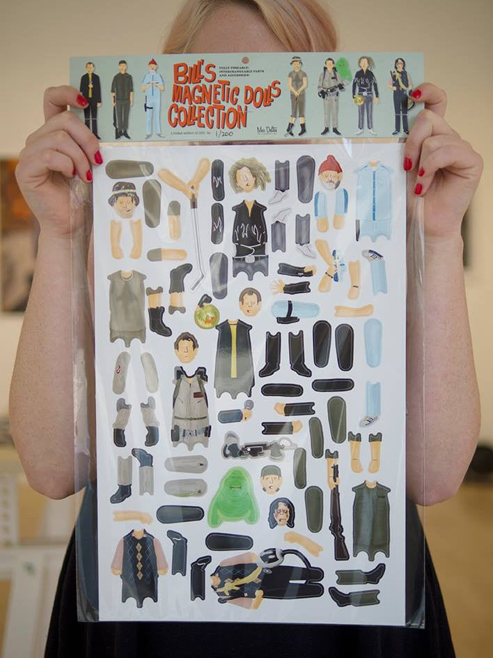 A person showcases a custom magnet set titled Bills Magnetic Dolls Collection with outfits and accessories inspired by Bill Murrays iconic roles, featuring styles from formal to casual. This unique product is offered by the brand name Max Dalton.