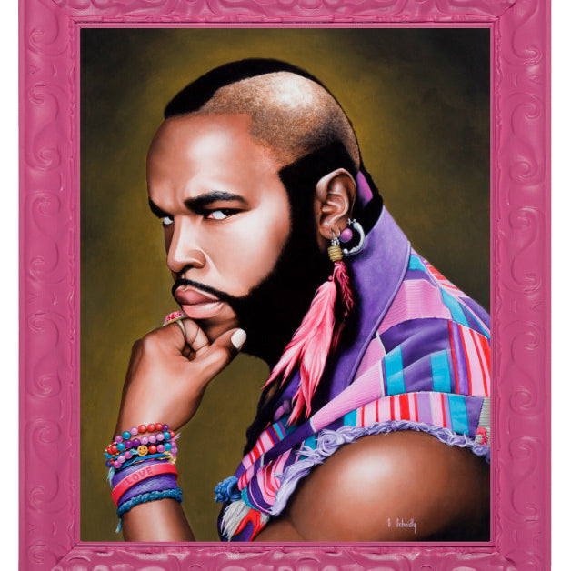 A Scott Scheidly portrait at Spoke Art Gallery captures a mohawked man in a vibrant scarf, large pink feather earrings, and bracelets, exuding Mr. T for Terrific vibes within an ornate pink frame.
