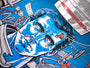 This Tim Doyle signed and numbered screen print depicts a futuristic blue-toned human face intertwined with wires, gears, and mechanical parts on a vibrant blue background, accented with red and gray highlights.