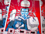 A stylized Tim Doyle screen print depicts a cyborg in red and blue futuristic attire, set against circuit and robotic elements on pearlescent paper. Japanese text at the bottom adds authenticity.