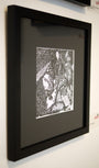 This framed black and white artwork, echoing Barron Storeys style, showcases a fantasy scene with a bow-wielding woman among snakes and winged creatures. Created with ink on paper, this captivating piece is available for sale.