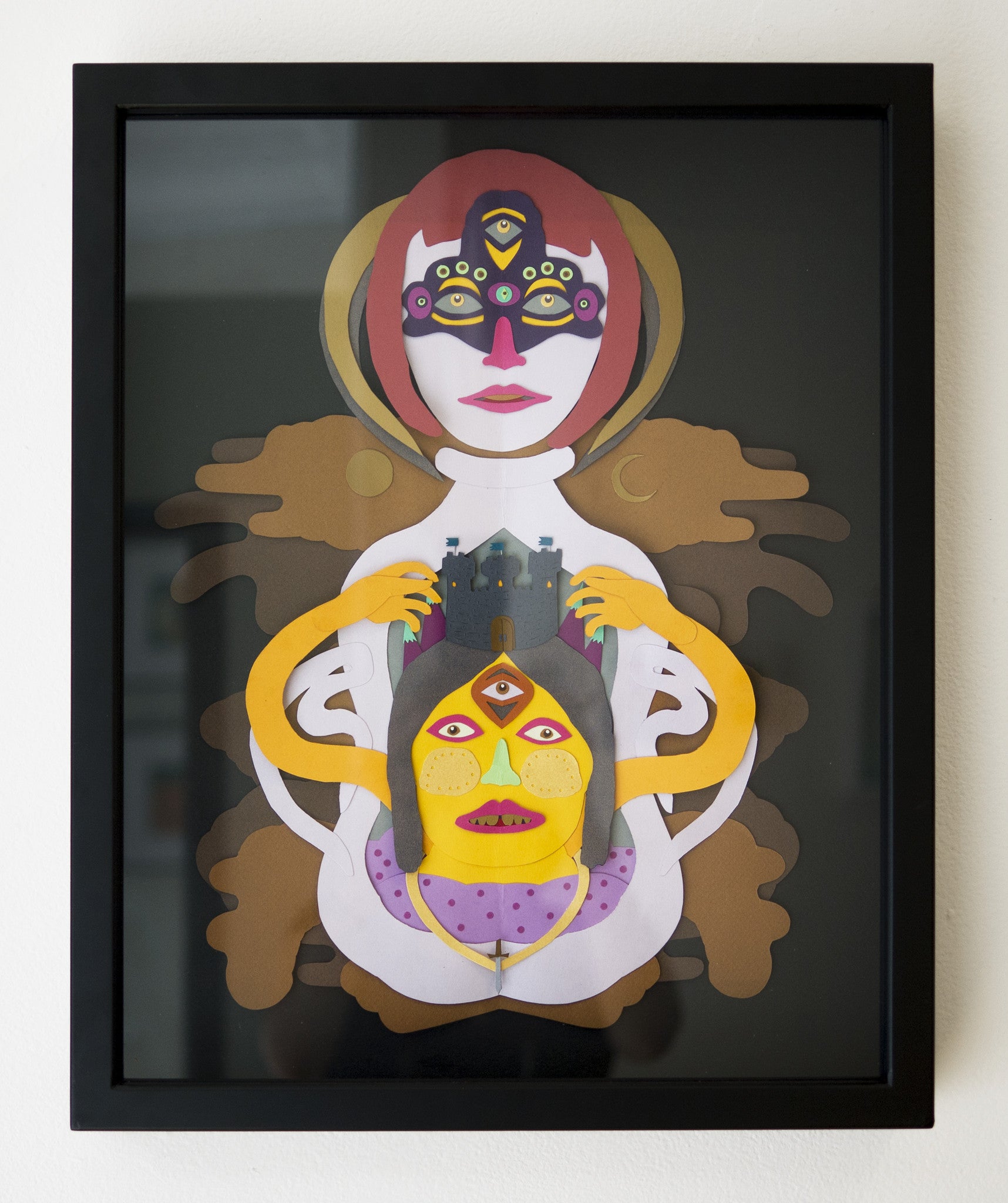 Framed abstract artwork by Daniel Jaffe showcases two stylized faces with bold colors and geometric shapes. The upper face exudes serenity, while the lower face is intense, featuring vibrant red, yellow, and purple details.