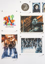At Spoke Art gallery, Nick Stokes wall display features archival pigment prints: a colorful abstract design titled Lord of the Rings. Below are posters with fantasy characters and another called Lord of the Coloring, showcasing a dramatic figure and bold lettering.