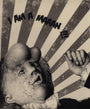 A surreal illustration by Rodrigo Cifuentes depicts a man in a suit with a distorted face, gesturing and surrounded by radiating stripes. The text I AM A MAAN floats above in liquid graphite, crafted in a monochromatic color scheme.