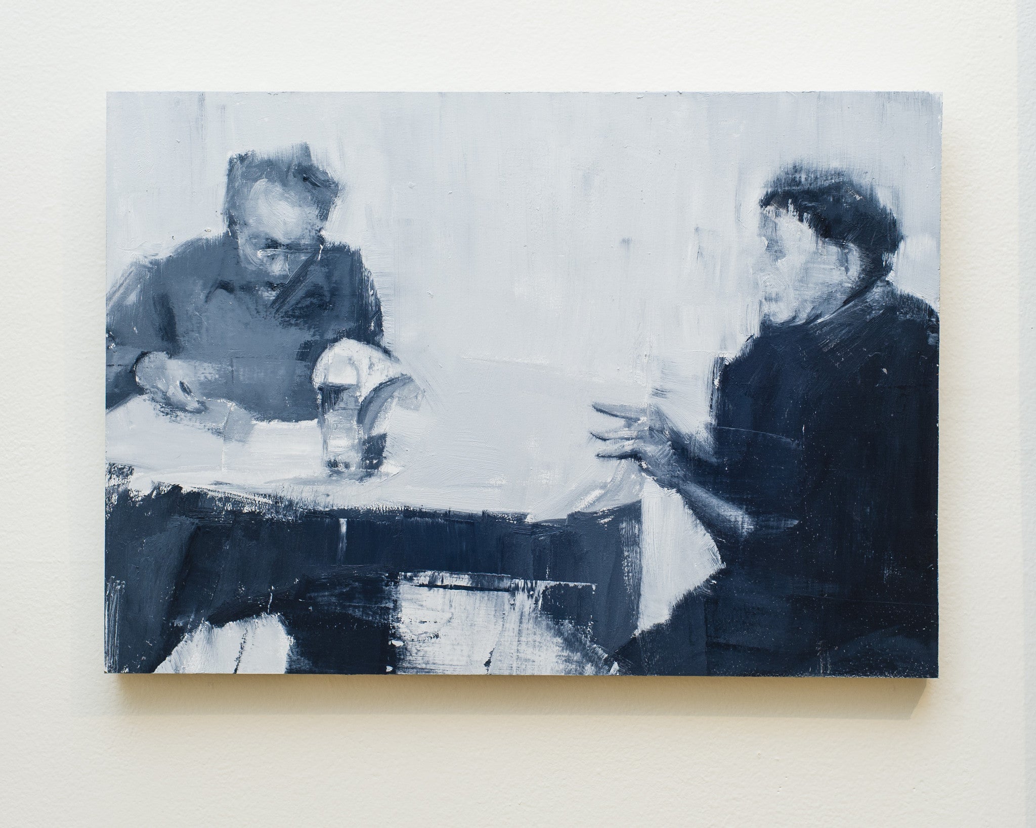 An oil on wood grayscale painting by Brett Amory features Ed and Gloria at a table, conversing. His distinctive sketchy, blurred style imparts an abstract and expressive atmosphere.
