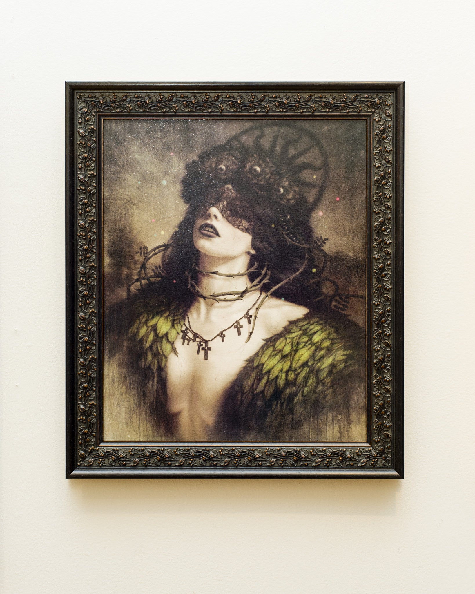 Tom Bagshaws digital painting features a woman whose eyes are covered by flowers and crowned with thorns. She wears dark lipstick and a feathered accessory, all framed in an ornate design inspired by Earthly Delights.