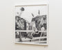 This Jonas Lofgren artwork, framed and crafted in graphite on paper, depicts a surreal scene where a woman lounges on a fence with a small house and trees on rocky hills behind her, blending realism with fantasy to create a dreamlike atmosphere.