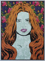 This Chuck Sperry illustration features a woman with long, flowing orange hair set against a vivid floral and leaf patterned background. Intricate detailing and floral motifs adorn her face, adding texture and depth to the silver variant design.