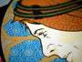 The limited edition screen print by Chuck Sperry depicts a persons profile with intricate patterns and vibrant colors. The individual wears a colorful, ornate hat against a backdrop of blue and orange geometric designs.
