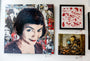 A wall displays three artworks: a textured portrait of a smiling woman with short hair like Amélie, an abstract red and white illustration, and Greg Gossels acrylic steampunk-style painting featuring robot characters.