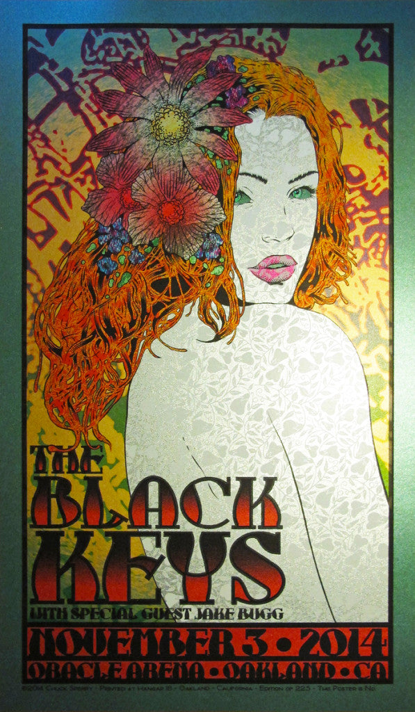 A vibrant concert poster by Chuck Sperry for The Black Keys features a floral-haired woman. It includes details of the event on November 5, 2014, at Oracle Arena, Oakland, CA, with Jake Bugg as the special guest.