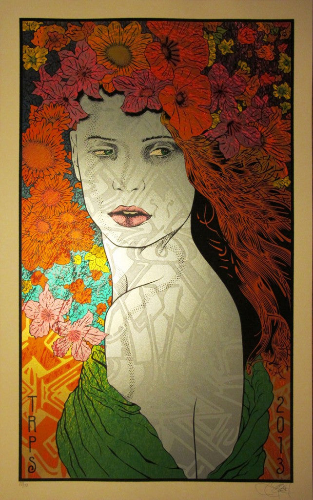 An artistic portrait by Chuck Sperry features a woman with long, flowing hair adorned with vibrant red, orange, and pink flowers. Dressed in green, she exudes classic rock poster art style against a lively 2013 background of colorful floral patterns.