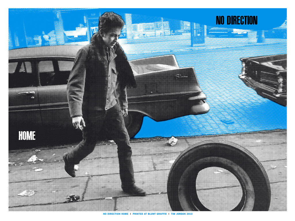 A person walks next to a vintage car and an upright tire on a blue backdrop with NO DIRECTION and HOME text. This Tim Jordan limited edition screen print evokes the nostalgic, retro vibe of a Martin Scorsese cinematic tribute.