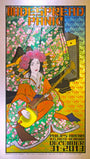 Vibrant concert poster by Chuck Sperry showcases a Japanese kabuki actress with a traditional instrument amidst floral designs. Crafted on Japanese mulberry paper and custom framed, it includes text for Philips Arena, Atlanta, Georgia, December 31, 2013.