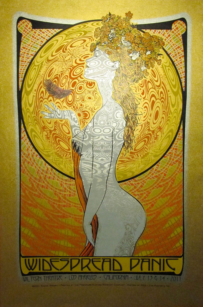 An Art Nouveau-style poster by Chuck Sperry shows a stylized woman with floral hair and a glass, set against an intricate circular pattern with gold Japanese Mulberry tones. The text below reads Widespread Panic, Wiltern Theatre, Los Angeles, California, July 13 & 14, 2011.