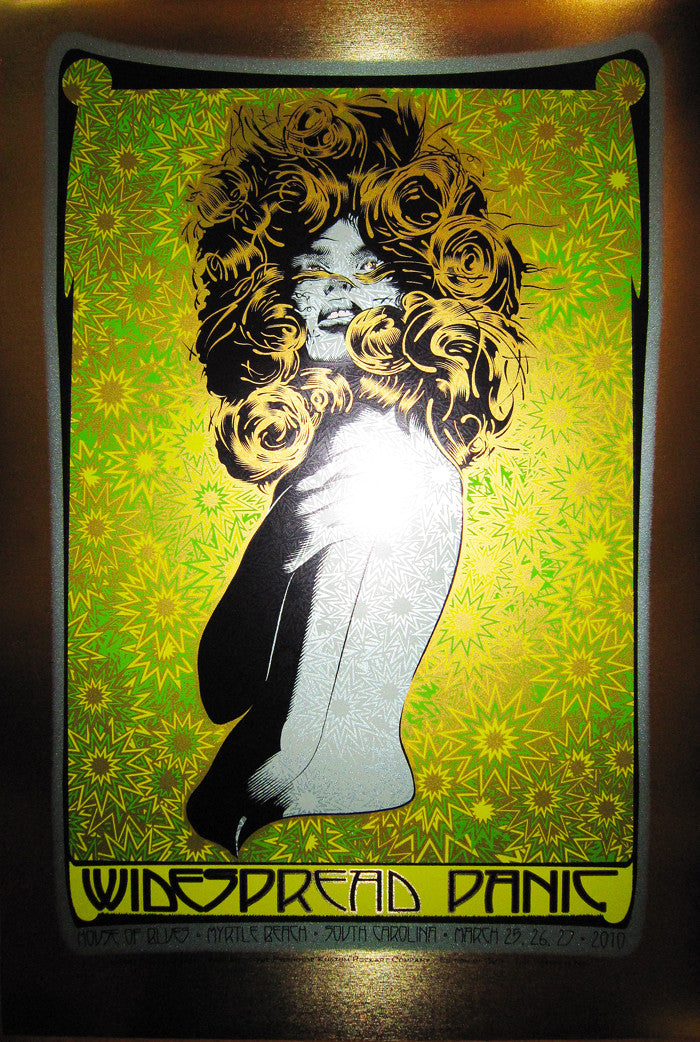 Chuck Sperrys psychedelic concert poster for Widespread Panic features a colorful abstract design with bold, swirling patterns in green, yellow, and black, highlighted by brushed gold foil accents. The Myrtle Beach event details from March 2010 gleam at the bottom.