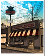 Tim Doyles hand-printed screenprint features a comic book store, The Androids Dungeon & Baseball Card Shop, with a red and white striped awning. A glowing Krusty Burger sign appears above, under partly cloudy skies with an empty street below.