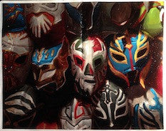 A vibrant Wall of Heroes, this collection showcases colorful lucha libre masks, tightly packed with intricate designs and hues of red, blue, and yellow. Reminiscent of Zachary Oldenkamps art style on oil-infused moleskine, each mask tells a story.