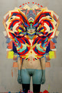 A digitally altered image shows a person with colorful abstract shapes forming a headdress and chest design, reminiscent of Erik Jones art. The neutral background contrasts with vibrant reds, blues, and yellows, reflecting the innovation seen at Art Basel Miami Beach.