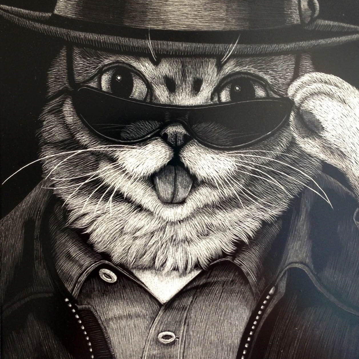 Tapecats fine art print portrays a cat in a fedora, sunglasses, and leather jacket with its tongue out, capturing a cool Heisenbub vibe. The monochrome style adds an edgy touch reminiscent of a star from the Lil Bub show.