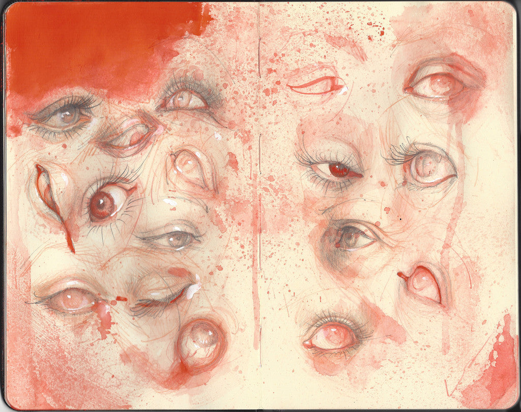 A sketchbook page from Shawn Barber features an eye study with detailed sketches of eyes, accented by vibrant red watercolor splashes. This mixed media artwork captures a dynamic array of emotions through varying sizes and expressions.