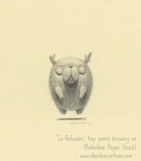 A small pencil drawing on light beige Moleskine paper features a round creature with antlers and delicate limbs floating centrally. Below is the text: In Between by Charles Santoso, displayed at Spoke Art Gallery - www.charlessantoso.com.