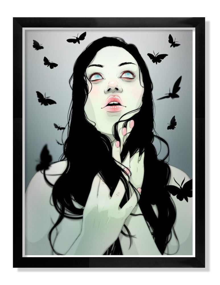This Jason Levesque archival giclée print features a stylized illustration of a woman with long dark hair, gazing upward with her hands near her face. Black butterflies flutter around her against a grey background. Its framed in black and detailed on premium watercolor paper.