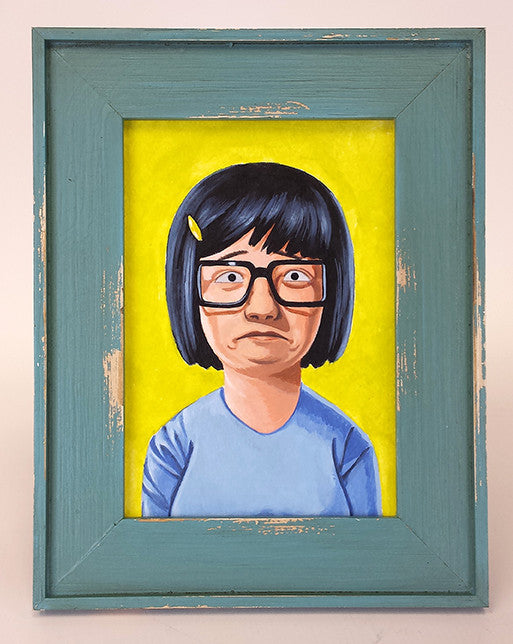 The Geoff Trapp framed painting A Portrait of Tina showcases a cartoon character from Bobs Burgers, wearing glasses and a blue shirt against a yellow background, with black hair featuring a yellow clip. The artwork is in distressed blue wood, echoing Spoke Art NYC exhibitions.