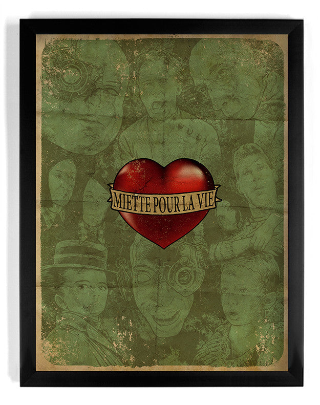 This limited edition Godmachine poster features a heart labeled Miette Pour La Vie at its center, surrounded by sketched faces on a vintage-style green distressed background, all framed with a black border. This fine art giclee captures timeless emotion and artistry.