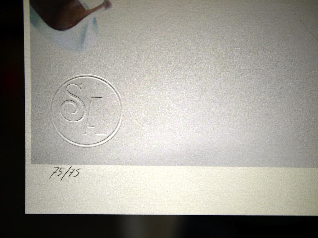 Close-up of a fine art giclee prints bottom corner showing an embossed circular logo with S and A partially visible. Below, the handwritten fraction 75/75 indicates a signed and numbered edition by Henrik Uldalen. The background is a light neutral color.