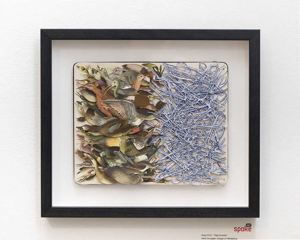 Hope Krolls framed artwork features a hand-cut paper collage of intricately arranged birds on the left, shifting into chaotic blue lines on the right. This dynamic piece will be displayed at the Moleskine exhibit, merging nature with abstract designs.