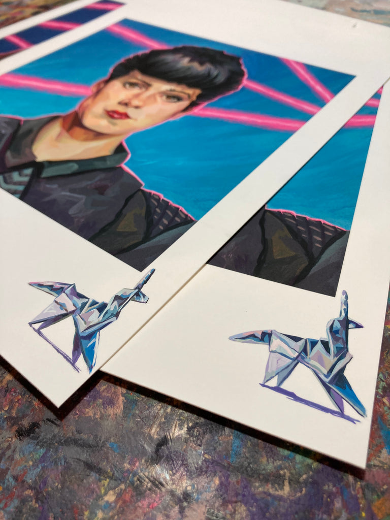 Rich Pellegrino portrait of Rachael from Blade Runner with light blue background and bright pink line accents, hand-painted origami remarque on bottom right of print