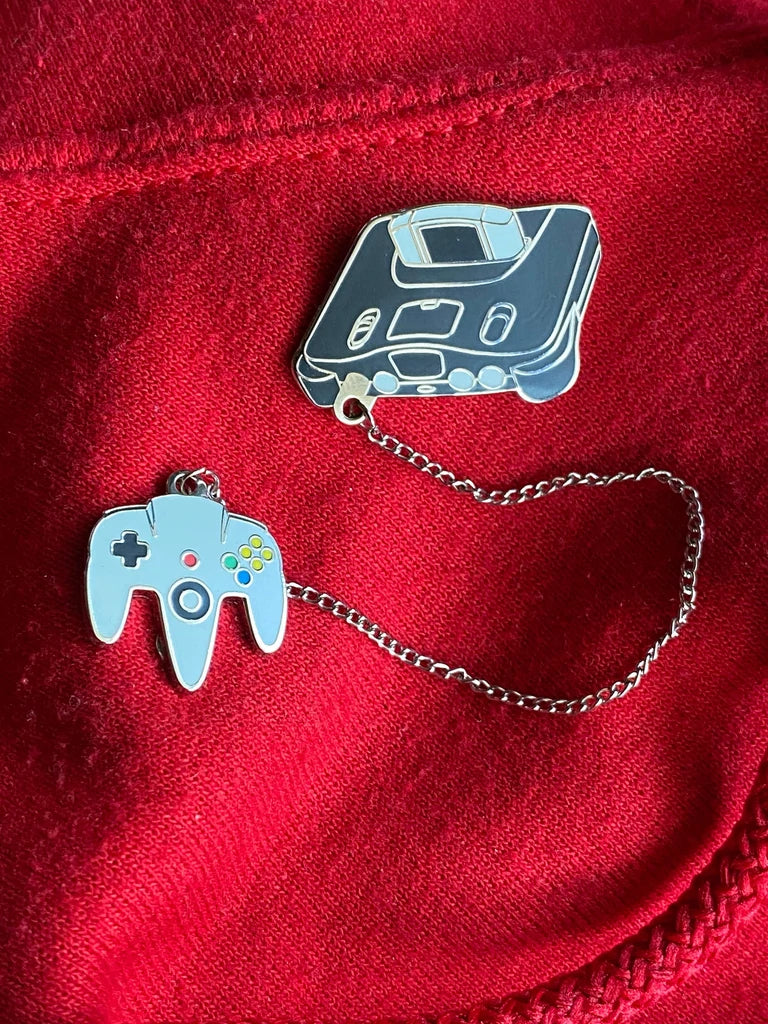 Nintendo 64 with silver chain to controller - 2 pin set on red sweatshirt