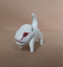 A small, white clay dinosaur figurine by Doubleparlour features red eyes and a long tail on a beige surface. The smooth, simplistic design stands out against the plain soft brown background, highlighting its hand-sculpted resin and acrylic paint details beautifully.