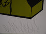 Close-up of a section of artwork with abstract black and yellow shapes, featuring an illegible cursive signature on a white background. This piece embodies the distinctive edge of Shark Toofs hand-printed fine art prints.