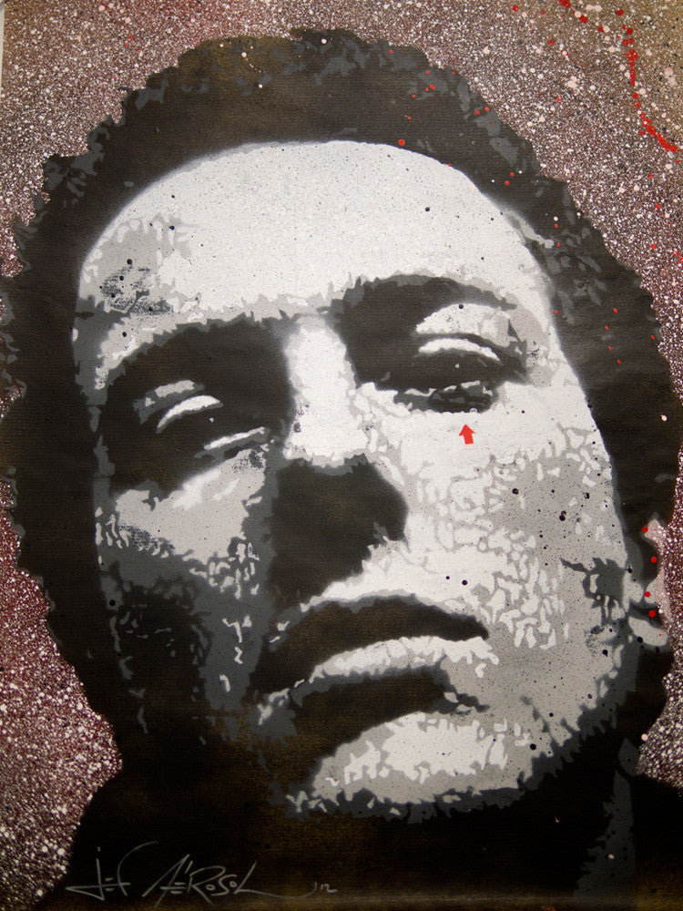 A grayscale stencil art piece reminiscent of Jef Aérosol, showcasing high contrast shadows. The neutrally expressed face, slightly tilted, is framed by a speckled red and white splatter background. Signature visible at the bottom.