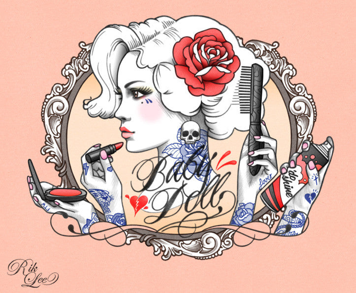 Rik Lees digital print showcases a retro woman with a red rose in her hair, tattoos, and holding a comb and lipstick, surrounded by ornate patterns and featuring the Black Doll text.