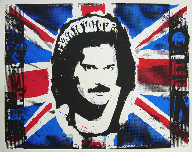 A Punchgut screen print showcases a mustachioed man wearing a crown against a worn British flag, featuring bold blue, red, black, and white colors with the text God Save the Queen.