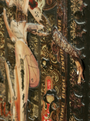 This mixed media collage by Handiedan showcases a vintage aesthetic with layered textures, featuring cutouts of tattooed legs and arms. It includes ornate patterns and text within an antique frame, complete with a small cartoon figure at the bottom.