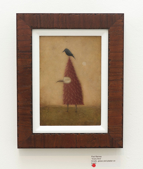 Paul Barnes acrylic painting features a tall red triangular-bodied bird with thin legs and a small black bird perched on its head, set against a muted backdrop with subtle textures, creating an intriguing and eerie essence.