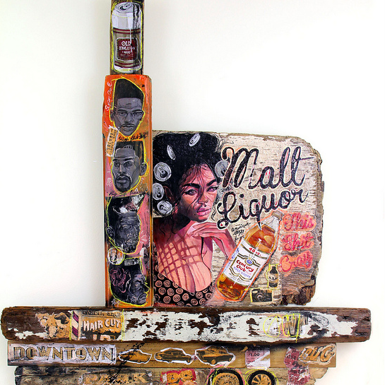 This mixed media artwork by Serge Gay Jr. features an acrylic painting of a woman with curlers holding a Malt Liquor bottle, surrounded by smaller portraits and urban-themed text and images, creating a vibrant display on wooden planks.